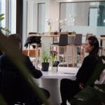 Flexible and hybrid workspace design with modular seating and collaborative areas promoting productivity.