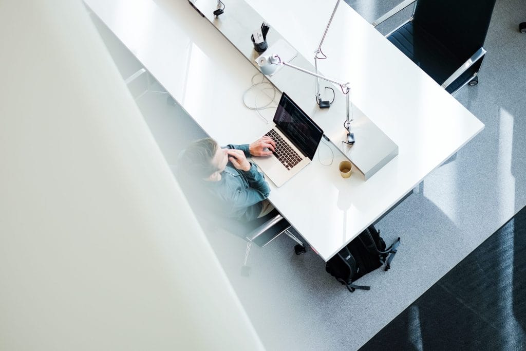 Ergonomic workspaces at EDGE featuring adjustable desks and biophilic design for enhanced comfort and productivity.